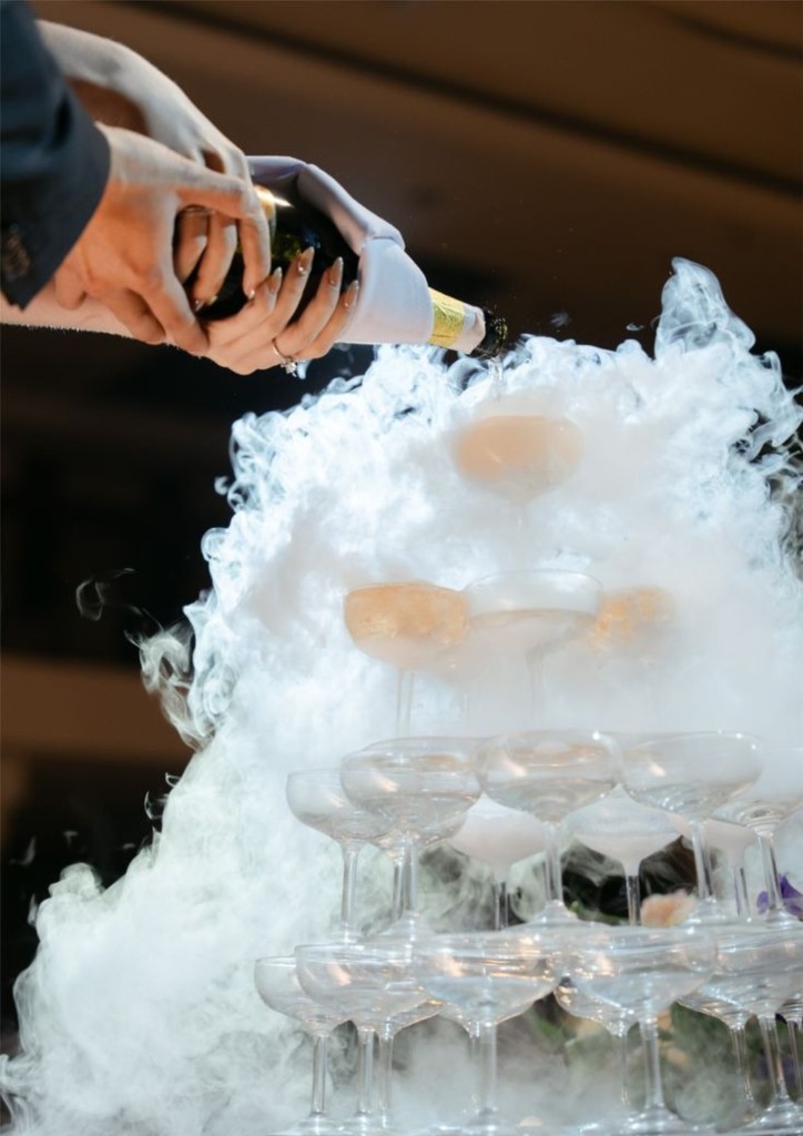 Champagne tower with dry ice at wedding reception